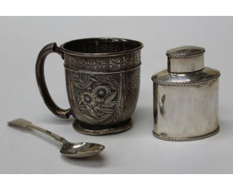 A George V silver tea caddy of oval shape with gadrooned rims, Birmingham 1911, 8cm, a mid 19th century Japonoise silver mug 