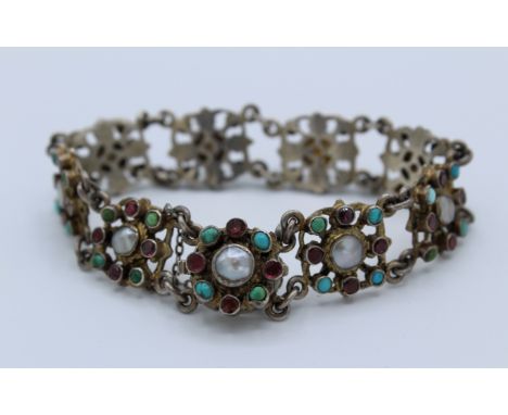An Austro-Hungarian garnet, turquoise and mabe pearl set bracelet. Set in 800 continental silver. With functional and secure 