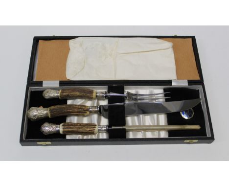 A horn handled carving set with white metal collars and terminals, a mussel and white metal decorative snuff box, a gold plat