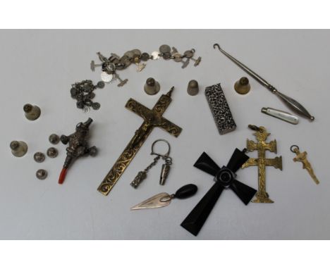 A group of silver and other bijouterie, including a Victorian rattle/teether, thimble, coin bracelets, two gilt metal crucifi