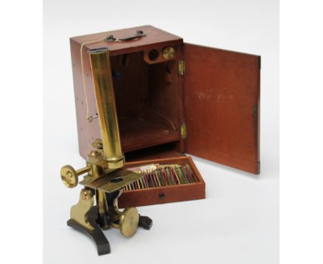 J H Steward, London. A mahogany cased brass microscope, No 643, with lenses and various tools. The base drawer enclosing twen