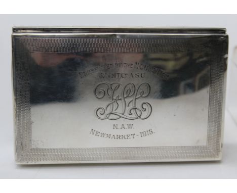 A and J Zimmerman, a George V silver cigarette box, with engine turned and presentation inscribed cover, Birmingham 1913, 14c