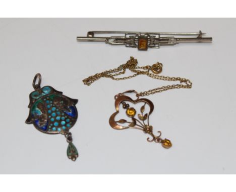 A collection of antique jewellery.  Featuring a "9ct" stamped Edwardian paste set lavaliere pendant; an as found Arts & Craft