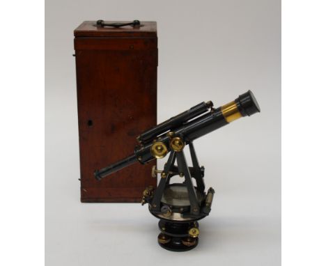 J Achbutt, London, a japanned surveyor's theodolite with various levels and a compass set base, in a fitted mahogany case bea