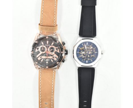 Two Edison automatic stainless steel wrist watches. The first having a blued skeleton dial, silver tone baton indices &amp; p