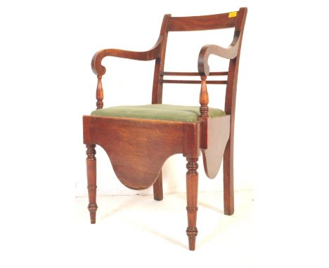 A 19th Century Victorian mahogany commode chair - armchair. The armchair with scrolled arms and tall, bar back. Structurally 