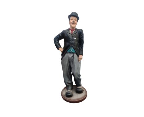 Charlie Chaplin - a large lifesize 1/1 scale statue of Chaplin, depicted in his trademark suit with bowler hat. Fibreglass co