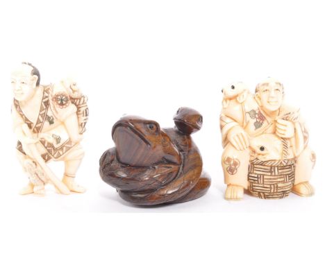 A collection of three 20th century Japanese resin faux ivory and boxwood netsuke modelled in the form of a snake wrapped arou