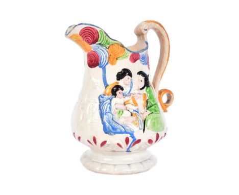 A 19th century religious Prattware jug, moulded in relief with scenes of Jesus, Mary and Joseph on one side and Saint Peter w