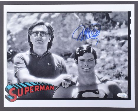 Superman (1978) - Richard Donner (1930-2021 Director) - autographed 11x14" black and white photograph showing him alongside C