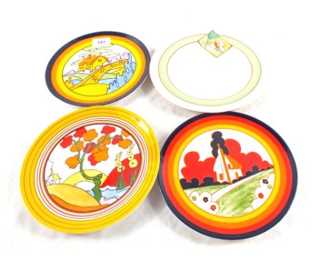 A Clarice Cliff plate plus three Wedgwood copies and a Christmas catalogue