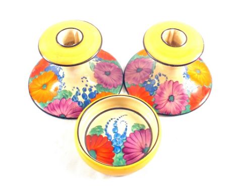 A pair of Clarice Cliff Gayday candlesticks plus a small dish