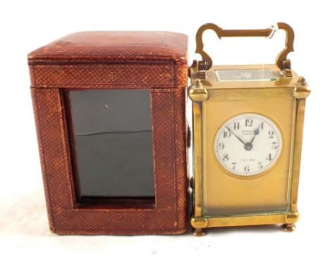 A Brooke & Sons of Edinburgh Brass carriage clock in original leather travelling case (light glass damage)