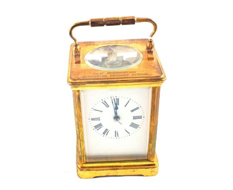 A Brass carriage clock with 1959 presentation inscription