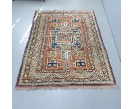 A vintage Turkish wool multi-coloured rug, 190cm x 142cm. 