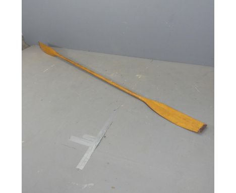A vintage pine kayak paddle, length 275cm, a folding cane panelled kayak seat, and associated slatted base. (3)