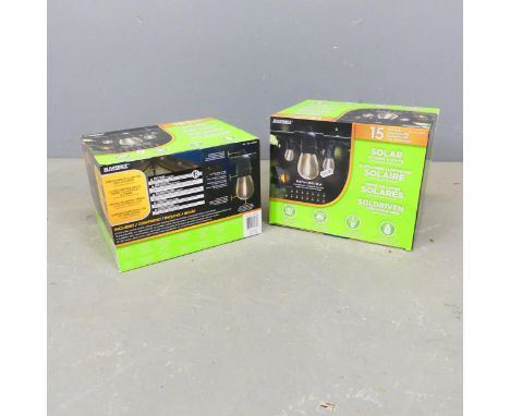 Two Sunforce solar powered garden light strings, each 35' long, in original boxes.