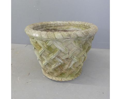 A weathered concrete circular planter, with lattice decoration. D50cm, H38cm. 