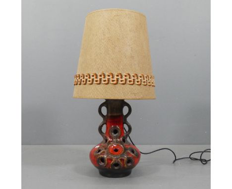 A mid-century West German Fat Lava pottery table lamp. H71cm.No marks to base. Will turn on when plugged in, but has not been