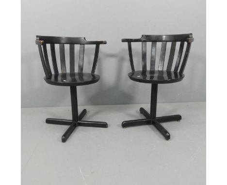 A pair of vintage beech black lacquered swivel open armchairs, in the manner of Sune Fromell and Jan Hallberg. 