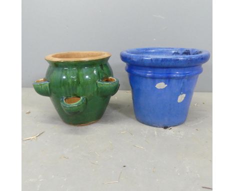 A glazed terracotta strawberry planter, D36cm, H29cm, and another glazed planter. (2) 