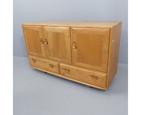 ERCOL - A mid-century blonde elm sideboard, with maker's label. W130cm, H76cm, D45cm.Some use related marks and scratches. Th