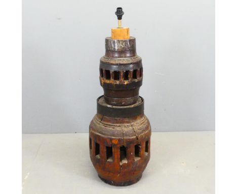 A two-tier elm floor lamp, formed from the hubs of carriage wheels. Height 93cm.