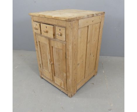 A Vintage pine cabinet, with three drawers and cupboard under. W50cm, H76cm, D55cm. 