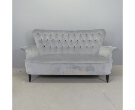 A mid-century button-back upholstered sofa, raised ebonised dansette legs. Overall W165cm, H87cm, D75cm, seat W130cm, H40cm, 