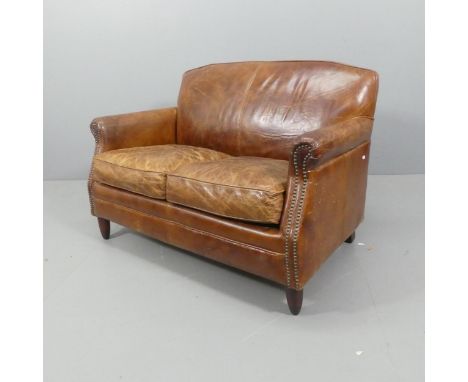 A French brown studded leather upholstered two seater sofa. Overall W122, H79, D80cm, Seat W95cm, H44cm, D45cm. 