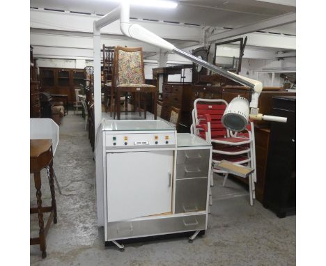 A vintage medical / dental work station, labelled for Hinders Leslies, with adjustable Hanau lamp. W85cm, H165cm, D47cm. 