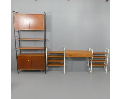 A Ladderax modular office suite, six uprights, two cabinets, one desk top, eleven shelves.Tall uprights D35cm, H200cm. Short 
