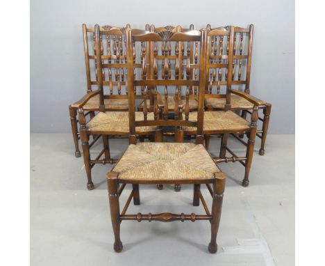 A set of six mahogany rush-seated North Country style dining chairs, with bobbin turned backs and carved decoration. (4+2) 