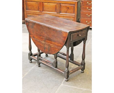 An 18th Century oak gate leg table with drawer. Min. L107cm D48cm H78cm