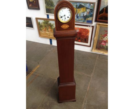 An inlaid mahogany granddaughter clock