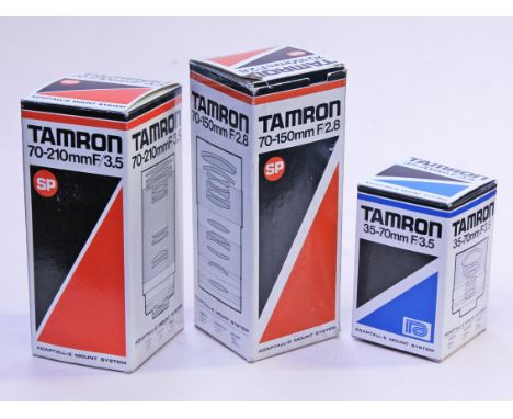 A group of three Tamron camera lenses. Condition - all appear unused.