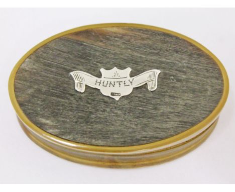A horn snuff box of oval form with unmarked silver plaque 'Huntly', length 8.5cm