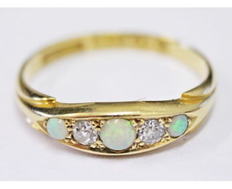 An Edwardian 18ct gold diamond and opal ring, gross wt. 2.8g, size O