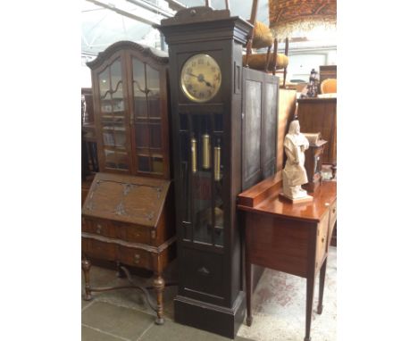 A 1920s oak Westminster Chime long case clock