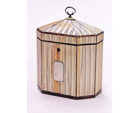A Regency ivory and tortoiseshell tea caddy. H15cm. Condition - hairlines to ivory and one piece broken and repaired, four pi