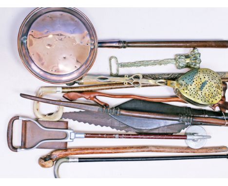 A mixed lot  to include a walking sticks, a brass door stop, a shooting stick, ornamental spears, a bed warmer etc.