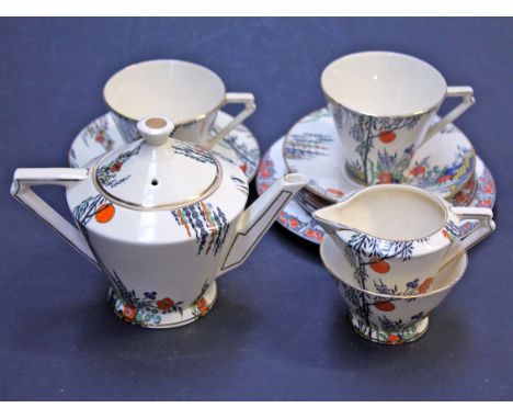 A Royal Cauldon Clair De Lune seven piece Art Deco tea set, together with three Crown Ducal Orange Tree plates. Condition - m