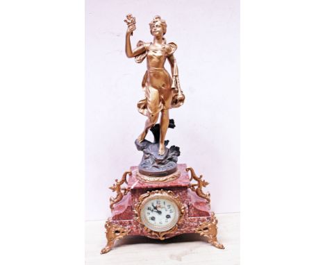 A French gilt metal mounted mantel clock. H59cm