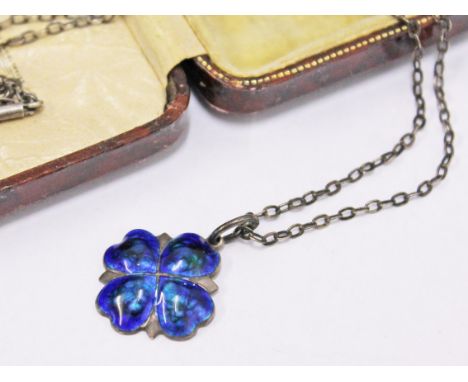 An Art Nouveau hallmarked silver and enamel four clover pendant on silver chain, with associated box
