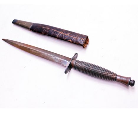 An FS fighting knife and scabbard. Condition - used.