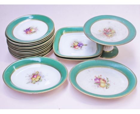 A Royal Worcester eighteen piece part dinner service, each piece with hand painted fruit decoration within a green and gilt b