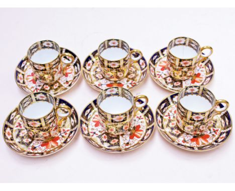 A set of six Royal Crown Derby coffee cans and saucers. Condition - one cup with hairline crack otherwise ok, no further dama