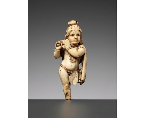 Ɏ AN IVORY FIGURE OF KRISHNA VENUGOPALA, PLAYING THE FLUTEIndia, 16th-17th century. Carved standing, his arms raised to the s