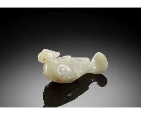 A CELADON JADE 'TURTLEDOVE' FINIAL, JIU, HAN DYNASTY 漢代青玉雕臥鳩China, 206 BC to 220 AD. Finely carved, the bird facing forward, 