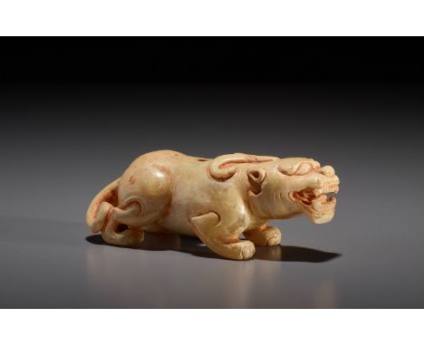 A SMALL JADE FIGURE OF A BIXIE, SIX DYNASTIES 六朝玉雕小辟邪China, 220-589. The mythical beast is shown crouched low in an attacking